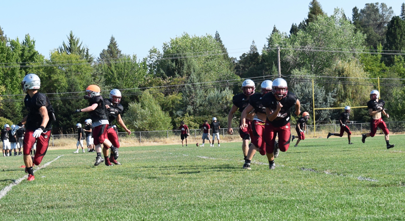 Football players say the sport is a positive, valuable part of their lives. Photo by Hailey Juergenson