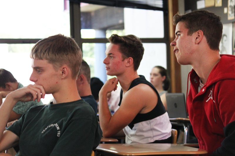 Seniors Isaac Drais, Peyton Turner, and Robbie Au listen to election discussion. Photo by Jared Pittsley