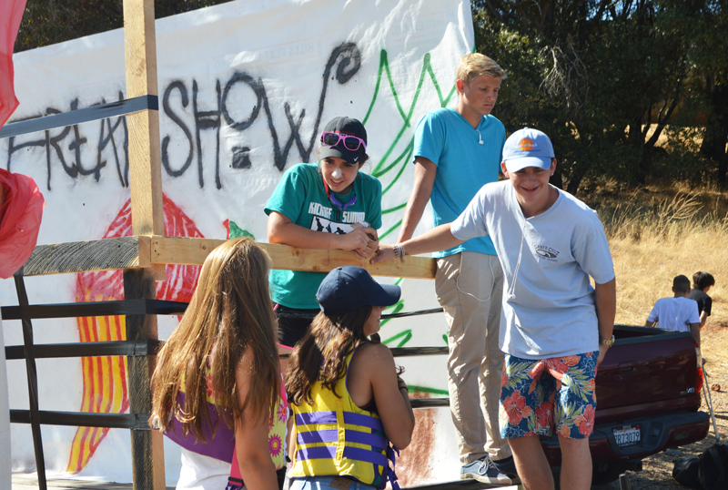 Sophomores Connor Castorina, Dylan Sinclair and Sage Rechenbach work on their class float. Photo by Mia Deen-Baum
