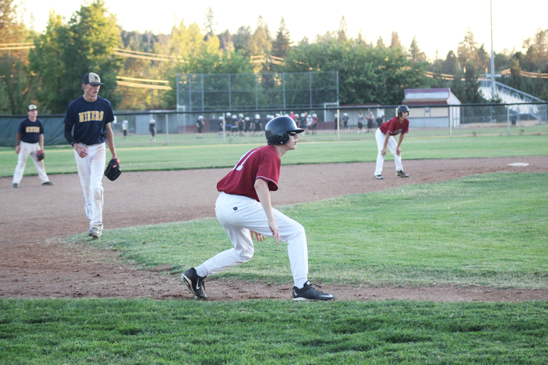 Jared Pittsley leads off third base. Photo by Cat Renner