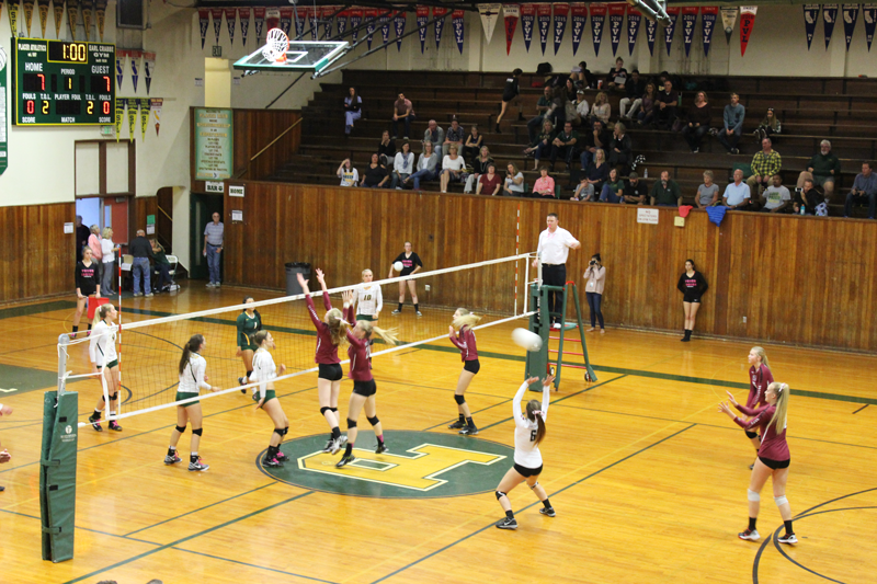 Kayla Toft, a junior, takes away an off-blocker touch from Placer. Photo by Alyssa Rice