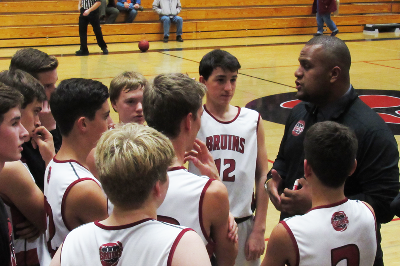 Coach Joey Jergo gives the Freshmen Basketball Team a pep talk. Photo by Sarah DeRise