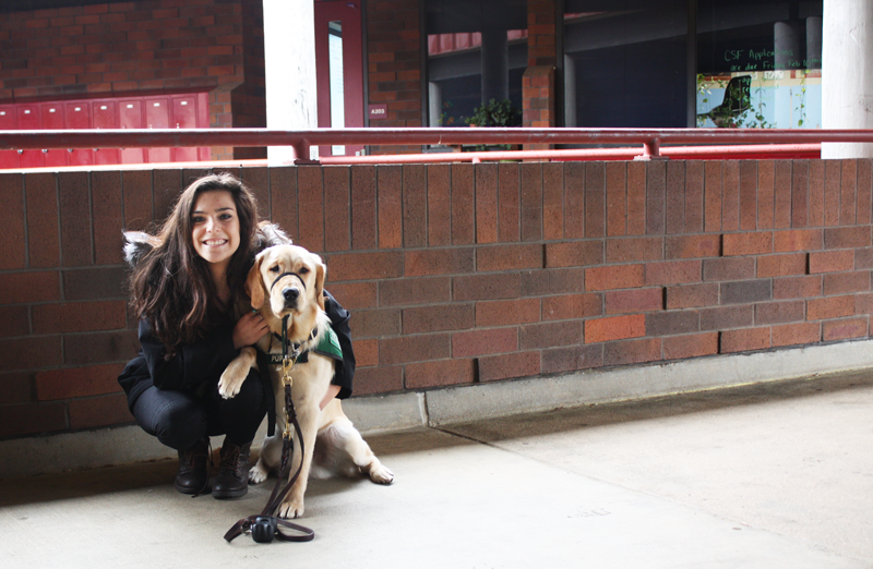 Faith Lampson poses with her guide dog in training Saint.  Photos by Hailey Juergenson