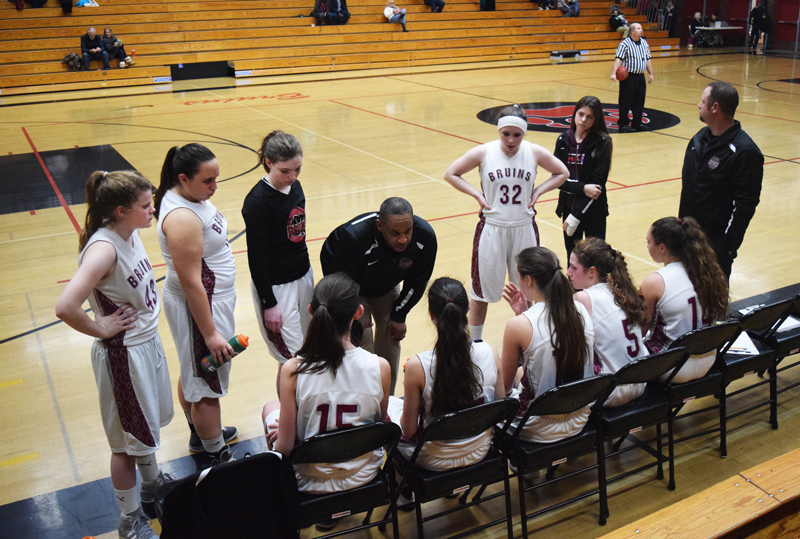 Junior Varsity Head Coach Ralph Lewis talks to the girls team  during a time out.  Photo by Claire Schad