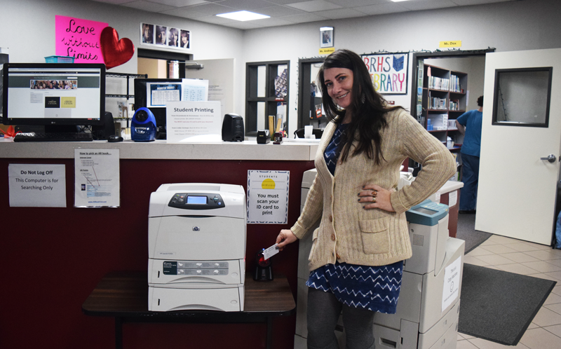 Librarian Josie Andrews shows off the  new printing system.  Photo by Hailey Juergenson