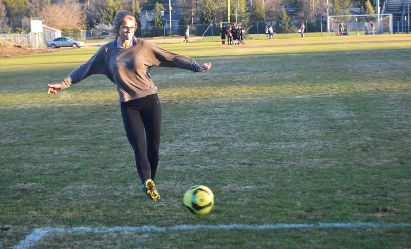 Lucy Livingston, a junior, takes a shot at the goal.  Photo by Brandon McGinnis