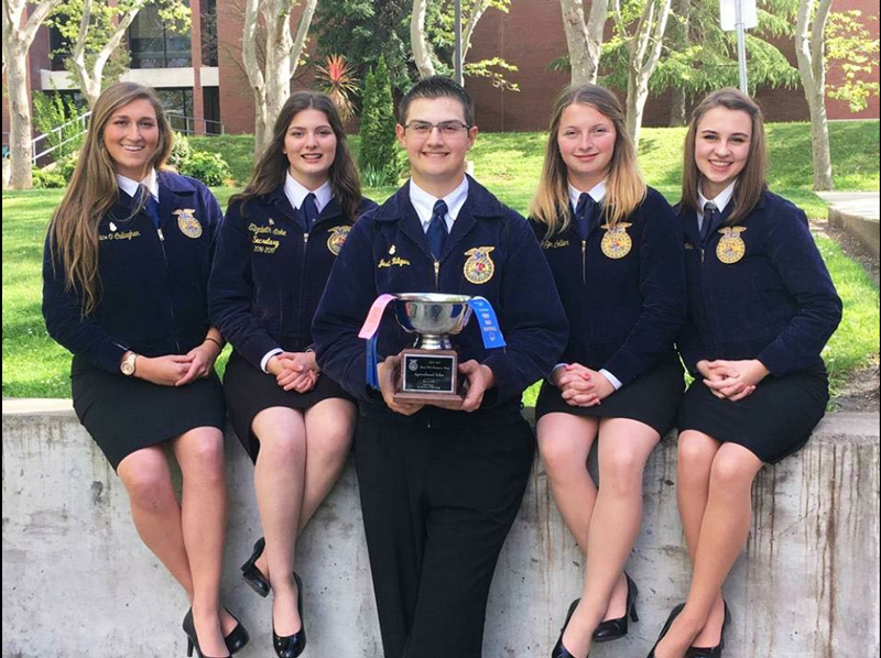 From left, Grace OCallaghan, a senior, Elizabeth Enke, a senior, Justin Kilgore, a junior, Jaytyn Collier, a junior, and Mary Foles, a senior, show off the silver bowl they won at the Ag Sales State Finals. Courtesy photo