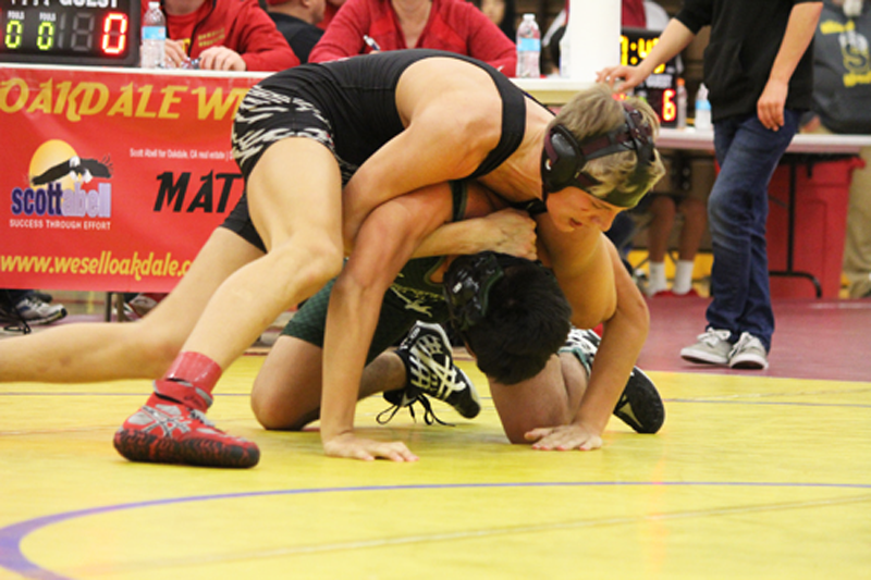 Junior Jacob Rivett grapples an opponent. Photo by Jamie Danieli