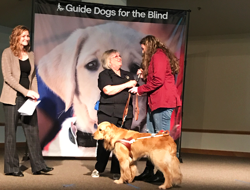 Senior Paige Zolldan hands over her guide dog Thelma to Claire Mansfield, who is blind. Courtesy Photo