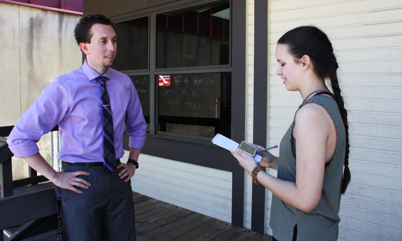 Sarah DeRise, a junior, interviews Activities Director Matt MacDonald about the tradition of prom and how it gets put together. Photo by Bella Batula