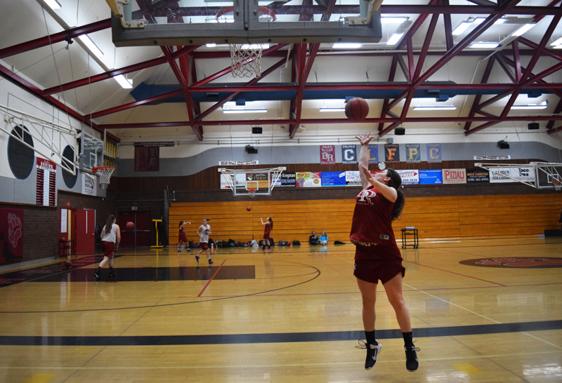 Varsity Basketball player Marie-Claire Desplancke, a junior, gets a rebound off the backboard during practice. Photo by McKenna Hisaw 