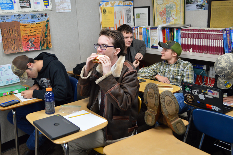 Seniors Garrett Graves, Dylan Hayes, Dylan King and C.J. Paul are relaxed in Economics class. Photo by McKenna Hisaw