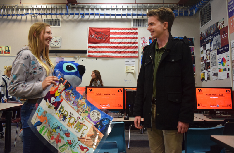 Senior Dylan Hayes  asks  Sophomore Madison Mantooth to prom with Disney fun. Photo by Kalei Owen