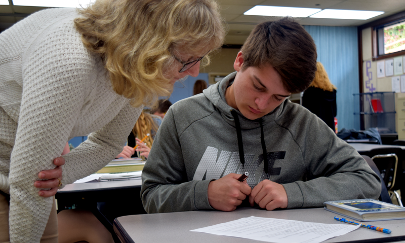 Caption here.  English Teacher Sherlyn Reafsnyder helps Junior Tyler Cross study for the CAASP tests. Photo by Bella Ferrari