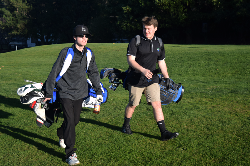 Members of the Boys Golf team practice. Photo by Kalei Owen
