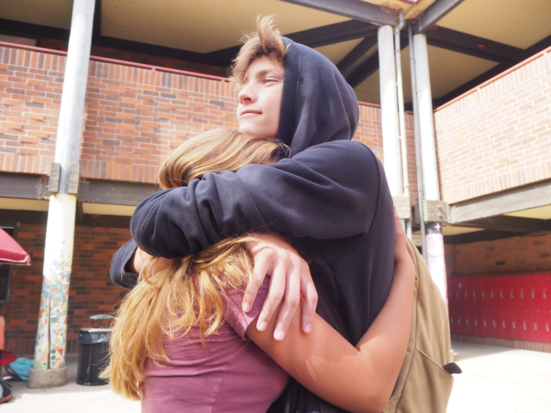 Junior Gabi Corallejo hugs her boyfriend Junior Wyatt Ronk. Photo by Zach Fink