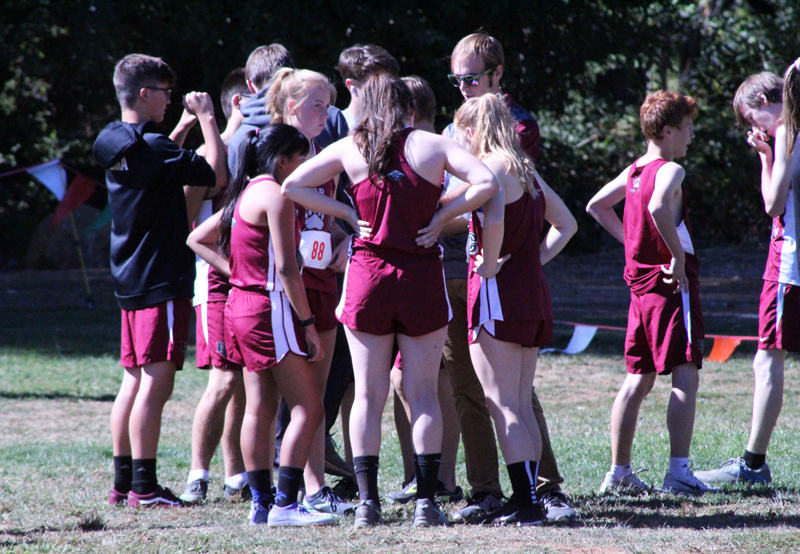 Head+Cross+Country+Coach+Skyler+Mousely+talks+to+Bear+River+runners.+Photo+by+Karissa+Johnson