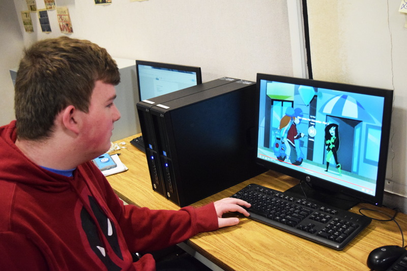 Sophomore Andrew Jeffers watches an episode of the original Kim Possible.  Photo by Martin Foster