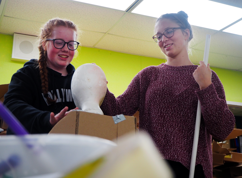 Freshman Bailey Ham and Sophomore Emily Adamson sort through materials for long-term problem. Photo by Kalei Owen