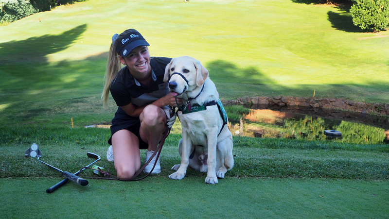 Senior+Madison+Templeton+poses+with+her+Guide+Dogs+for+the+Blind+puppy+Frosty+after+golf+practice.+Photo+by+Kalei+Owen