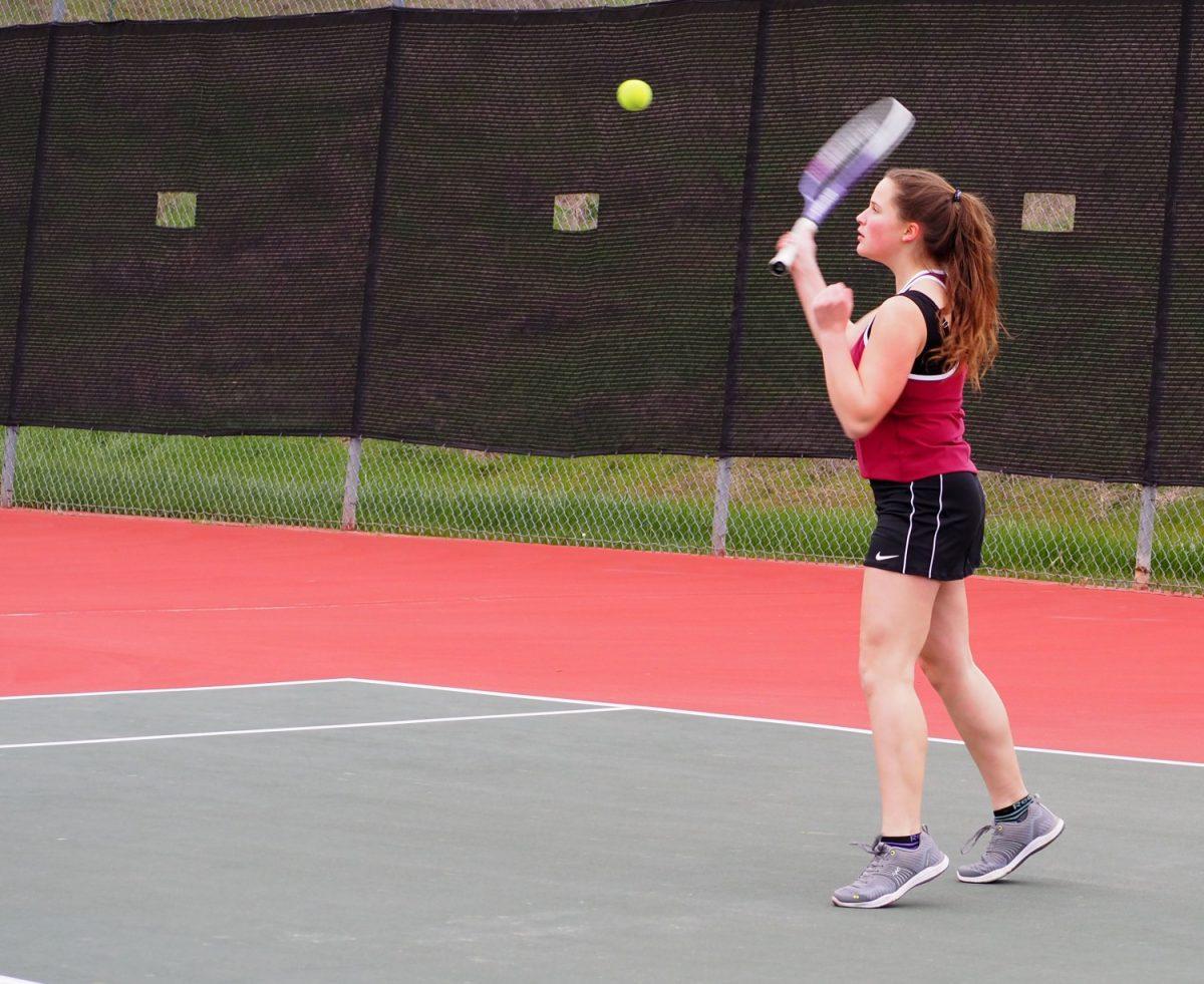 Sophomore+Vanise+Nunez+focuses+closely+on+the+ball+during+tennis+practice.++Photo+by+Emily+Bakey+