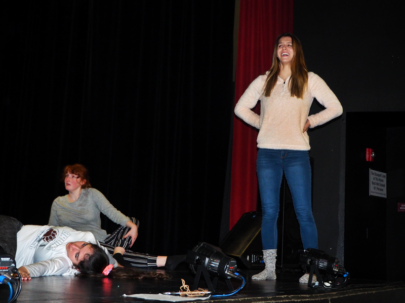 Emily Barrozo assists Starlite members in learning new dances.  Photo by Kalei Owen 