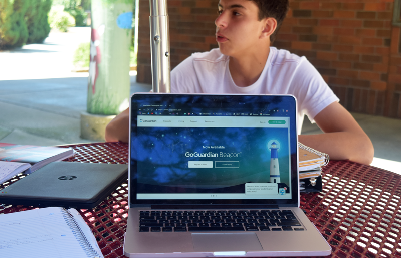 Junior Caleb Lowrys chromebook is restricted by the newly installed security program, GoGuardian.  Photo by Makenna Hensley. 