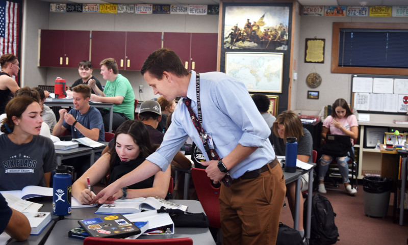 New history teacher, Trent Duffey, exemplifies his willingness to help his students.  Photo by Mariah Davidson. 