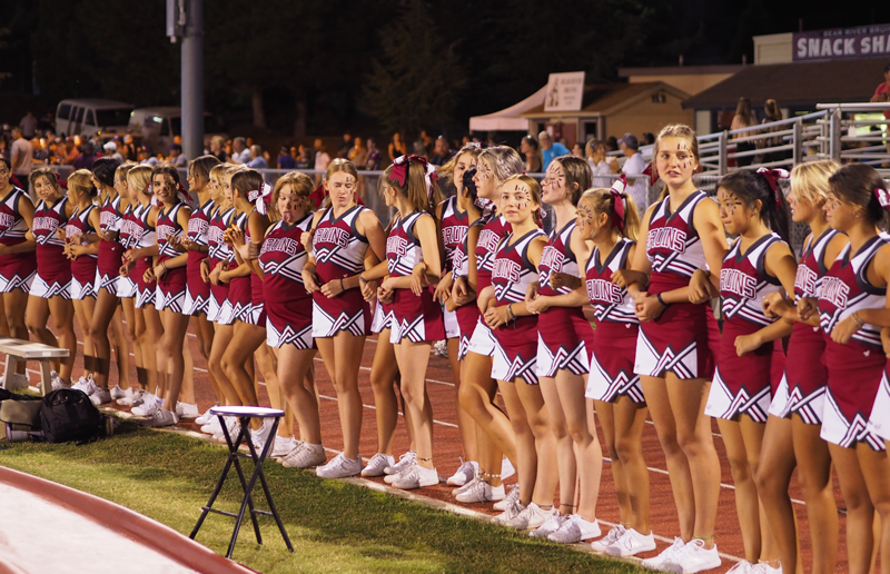 The Bruin Cheer team pumps up the crowd at every football game.  Photo by Maddie Meilinger 