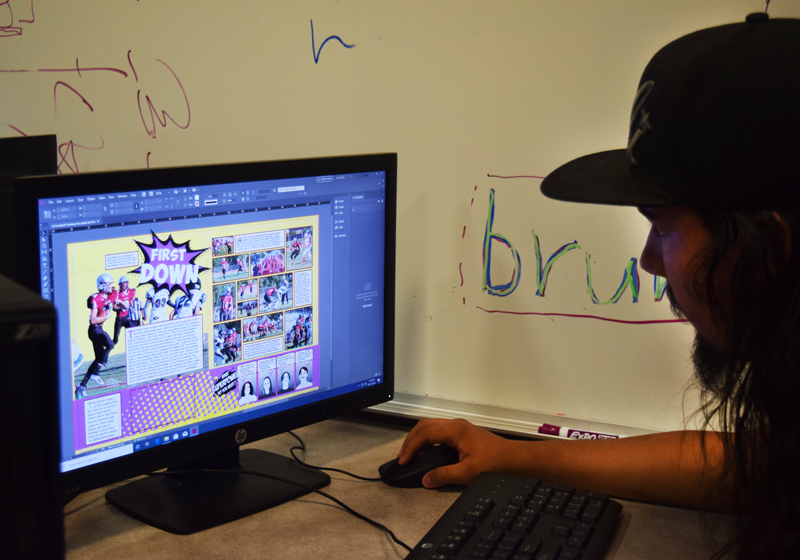 Senior Sebastian Carranza along with other yearbook editors are hard at work to create a super book for students to enjoy.  Photo by Isaiah Williams 