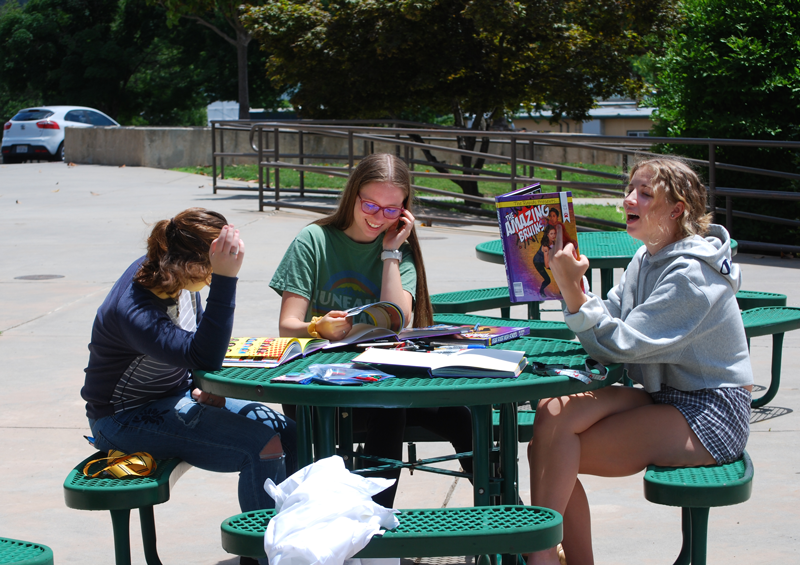 Juniors Hannah Morris, Emily Adamson, and Olivia Lyman gathered to sign yearbooks. Photo by Maddie Meilinger