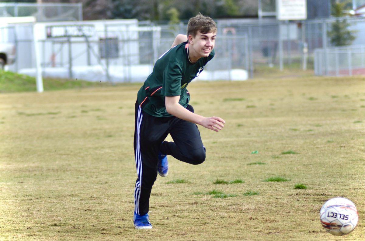 Senior Tanner Roberts practices hard during his last soccer season of high school. Photo by Maya Bussinger