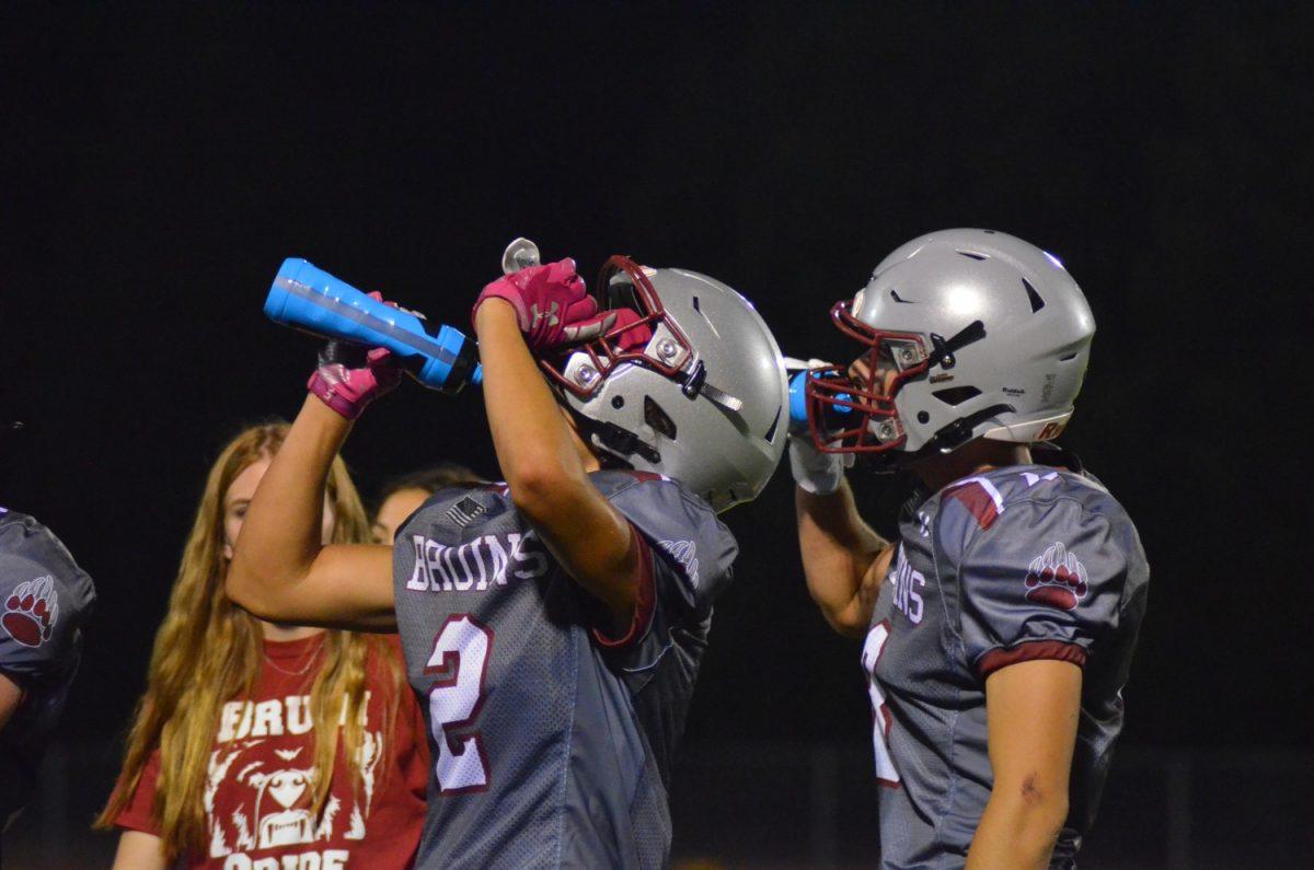 Bear River football players try to stay hydrated during the burning heat. Photo by Maya Bussinger