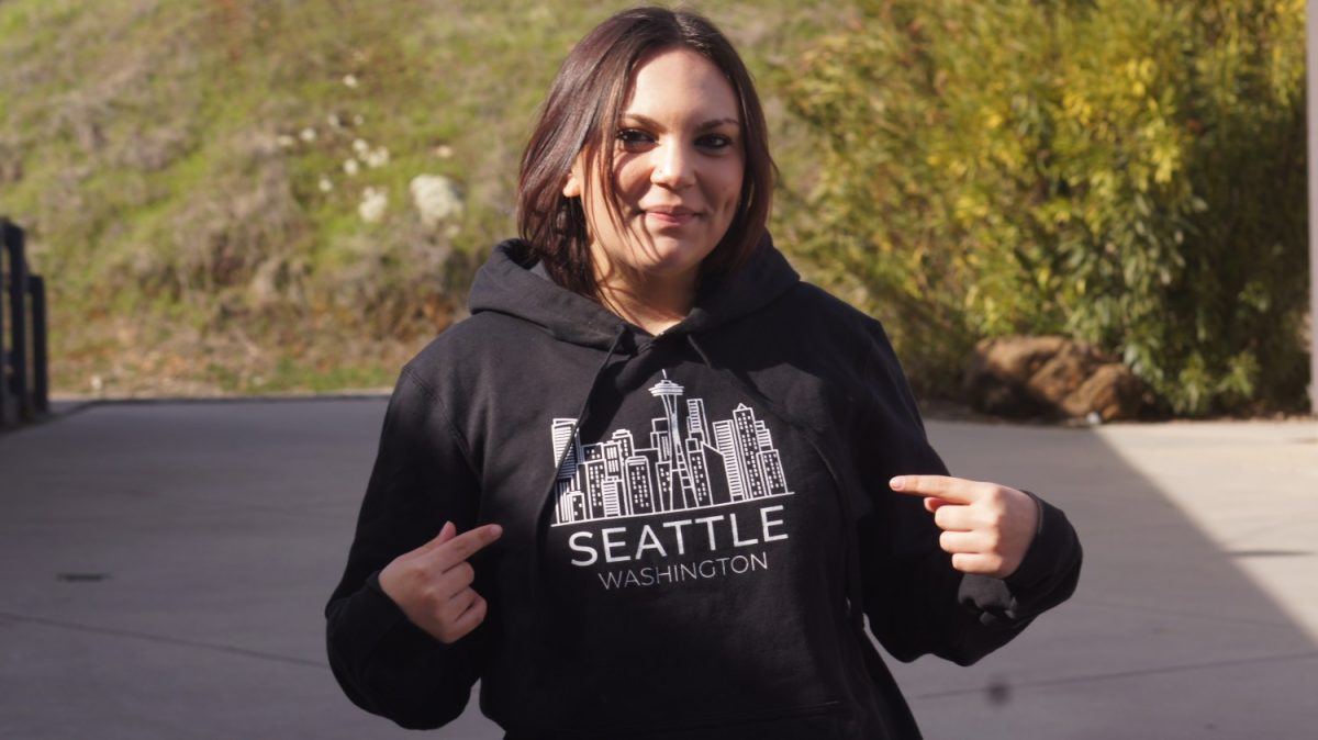 Senior Jaydah Montgomery, confident in her future college, shows off her Seattle Film Institute sweatshirt. Photo by Angelina Williams