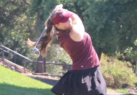 Senior Margaret Ralston finishing her swing.
